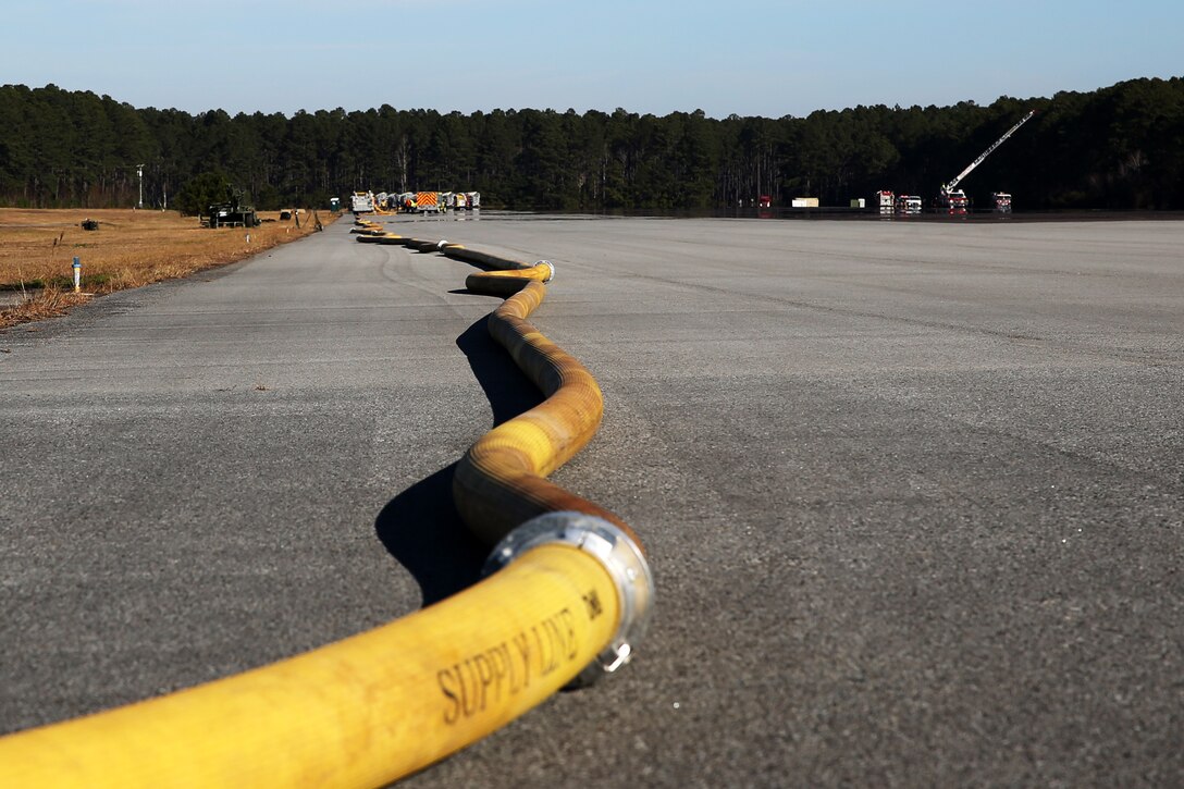 Cherry Point Fire and Emergency Services connected more than a mile of hose during a joint training drill with eight local fire departments at Marine Corps Air Station Cherry Point, N.C., Dec. 17, 2014. The drill was designed to test the capabilities of each department under various conditions.