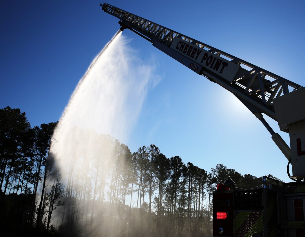 Water flows smoothly during a water relay drill conducted at Marine Corps Air Station Cherry Point, N.C., Dec. 12, 2014. Cherry Point Fire and Emergency Services hosted the drill with eight local fire departments to test the capabilities of each department under various conditions.