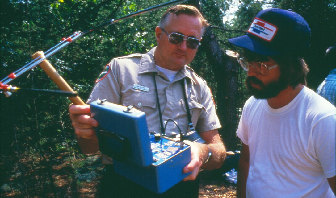 Bob Hatcher, Tennessee Wildlife Resources Agency, explains how to track the American Bald Eagle to Jimmy Carter, biology student at Tennessee Technological University, at Dale Hollow Lake Sept. 12, 1988. The U.S. Army Corps of Engineers released 44 eagles during the Eagle Restoration Program between 1987 and 1991.