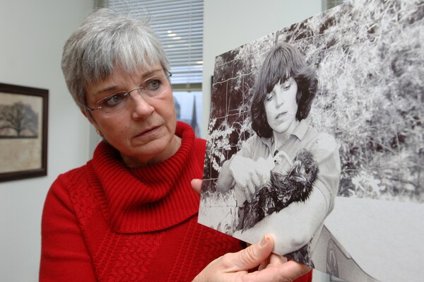 Patty Coffey, deputy chief of the U.S. Army Corps of Engineers Nashville District Operations Division, holds a photo in her office Dec. 8, 2014 of her hydrating a young American Bald Eagle at Dale Hollow Lake July 27, 1989 as part of the Eagle Restoration Project. Coffey, a wildlife biologist, served as the project manager for the program that transported 18 eaglets in July 1989 from Wisconsin and Alaska to Tennessee to reestablish the American Bald Eagle to the upper Cumberland region.  Twelve eaglets were bound for the Tennessee Wildlife Resources Agency to place at Chickamauga Lake, although one died during the trip, and six were resettled at Dale Hollow Lake. A total of 44 eaglets were resettled at Dale Hollow Lake between 1987 and 1991. 