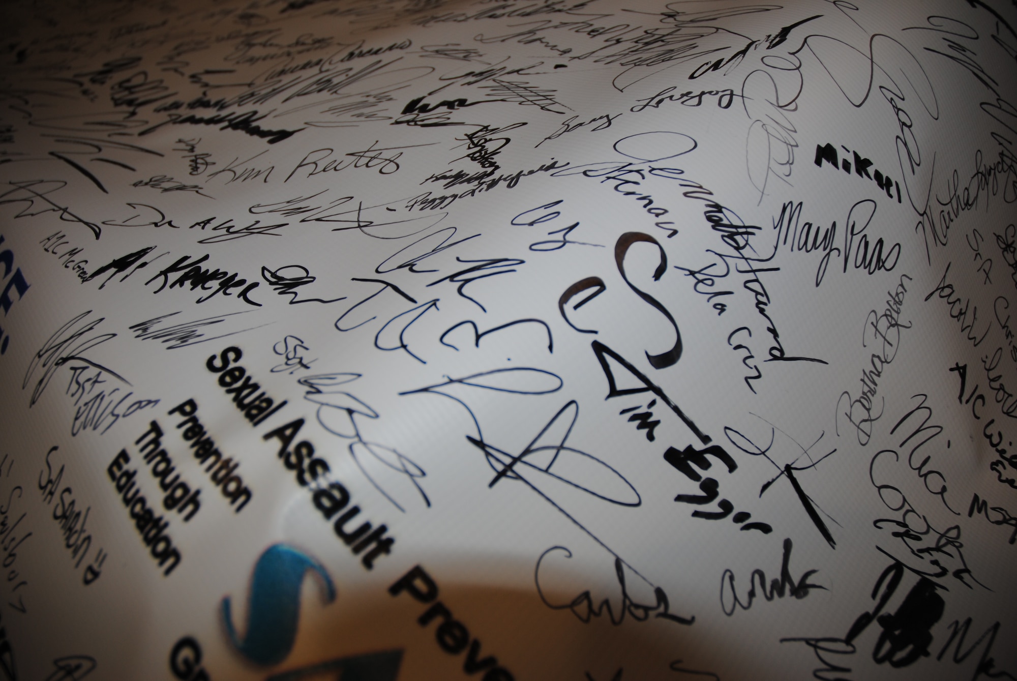 Grand Forks Air Force Base members showed their support for the 2015 Year of Respect campaign by signing the banner on display Dec. 18, 2014, at the Airey Dining Facility on Grand Forks Air Force Base, N.D.  The SAPR office promoted Resolution: Respect to more than 400 people from the base. (U.S. Air Force photo/Staff Sgt. Luis Loza Gutierrez)(U.S. Air Force photo/Staff Sgt. Luis Loza Gutierrez)