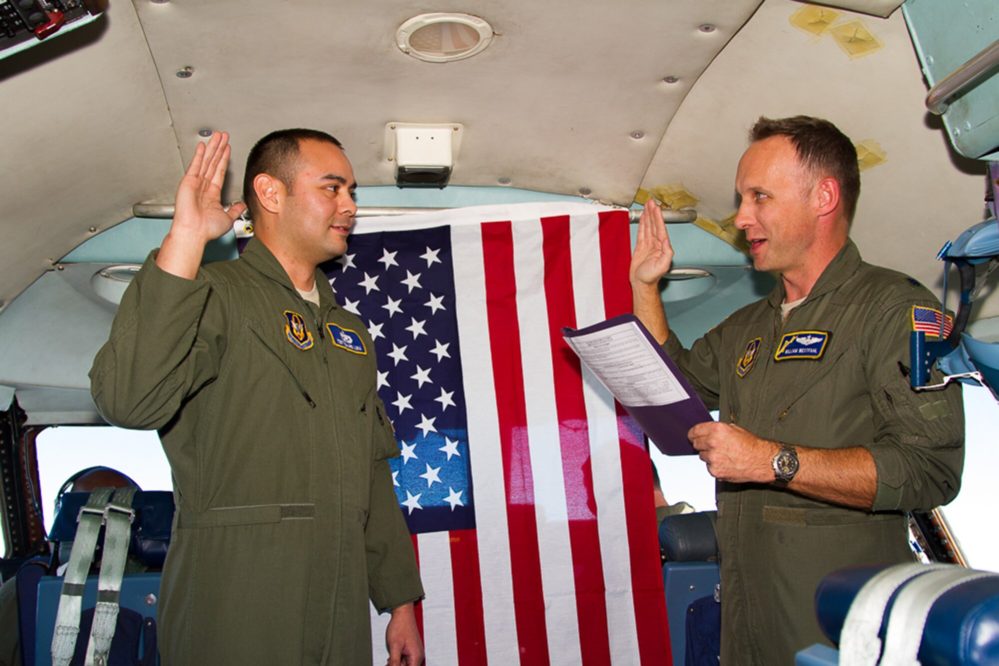 TRAVIS AIR FORCE BASE, Calif. -- On 6 December 2014, Tech. Sgt. Edward Luna, 349th Aircraft  Maintenance Squadron, C-5 Flying Crew Chief, reenlisted inflight aboard a 349th AMW C-5 Galaxy. 