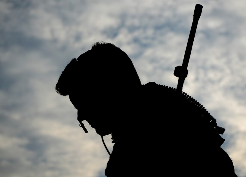 A U.S. Air Force joint terminal attack controller from the 66th Weapons Squadron (WPS), Nellis Air Force base, Nev., communicates with the aircrew of a 77th WPS B-1B Lancer, from Dyess Air Force Base, Texas, Oct. 21, 2014, at Snyder Electronic Warfare Range, Snyder, Texas. Training between the 66th WPS and Dyess’ 77th WPS provides both units with opportunities to hone skills used during real-world operations. (U.S. Air Force photo by Senior Airman Peter Thompson/Released)