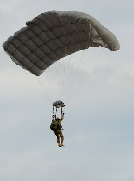 A U.S. Army Special Forces Soldier parachutes toward the ground during a simulated airfield seizure Oct. 21, 2014, at Snyder Electronic Warfare Range, Snyder, Texas. U.S. Air Force B-1B Lancers from the 77th Weapons Squadron, Dyess Air Force Base, Texas, provided close air support as C-130Js from the 39th Airlift Squadron, also from Dyess, provided airlift capabilities for the exercise. (U.S. Air Force photo by Senior Airman Peter Thompson/Released)