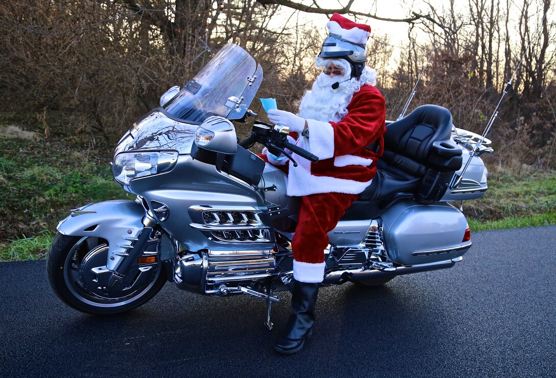 Santa reminds you that the 932nd Airlift Wing offices are officially closed on Christmas Day, December 25 and Friday, December 26.  Most of the wing will return on Monday, December 29.  In the meantime, if you think the weather is getting bad, before leaving for the base please call the Scott Weather Hotline at 618-256-SAFB to see what the road and base conditions might be before heading out in snow or ice.  Sometimes the base will close due to dangerous conditions, and sometimes it might have a delayed reporting of a couple of hours.  Please use your own judgment depending on where you live and the roads you must travel; call your supervisor if you need to come in later.  Be safe and watch out for motorcycles please! Santa was played this year by Senior Master Sgt. William Bassett of the 932nd Command Post.  He is a former motorcycle instructor.  (U.S. Air Force photo/Tech. Sgt. Christopher Parr)