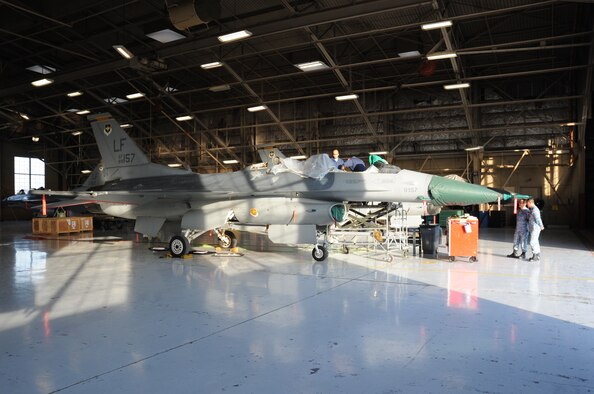 An F-16D Fighting Falcon undergoes repairs to the longeron due to cracks. This is one of the last aircraft to be repaired. (U.S. Air Force photo/Staff Sgt. Luther Mitchell Jr.)