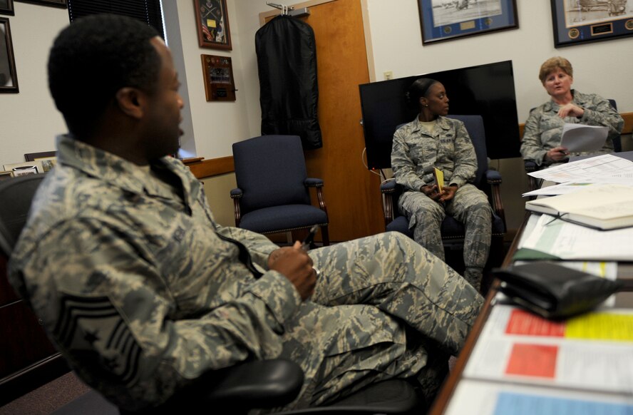 U.S. Air Force Airman 1st Class Alisha Taylor, 7th Logistic Readiness Squadron, sit with Chief Master Sgt. Eddie Webb, 7th Bomb Wing command chief, and Chief Master Sgt. Angela Bland, 7th Medical Group superintendent, Oct. 16, 2014, at Dyess Air Force Base, Texas. Taylor works at customer service for the 7th LRS and was raised in a military family prior to enlisting in the Air Force. (U.S. Air Force photo by Airman 1st Class Alexander Guerrero/Released)