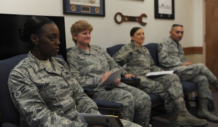 U.S. Air Force Airman 1st Class Alisha Taylor, 7th Logistic Readiness Squadron, left, attends a Chiefs Group meeting Oct. 16, 2014, at Dyess Air Force Base, Texas. Taylor was selected to participate in the “Thursdays with Chief” program where she shadowed Chief Master Sgt. Eddie Webb, 7th Bomb Wing command chief, throughout the day to gain insight on the chief’s daily routine. (U.S. Air Force photo by Airman 1st Class Alexander Guerrero/Released)
