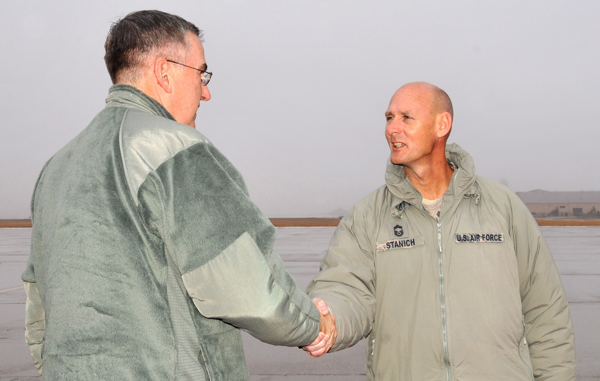 Gen. John E. Hyten, Air Force Space Command commander, greets Chief Master Sgt. Terrence Stanich, 319th Operations Support Squadron chief enlisted manager, Dec. 22, 2014 on Grand Forks Air Force Base, N.D. Hyten made the trip from Peterson Air Force Base, Colo., to visit members of Cavalier Air Station, N.D., ahead of the winter holidays. (U.S. Air Force photo/Staff Sgt. Susan L. Davis)