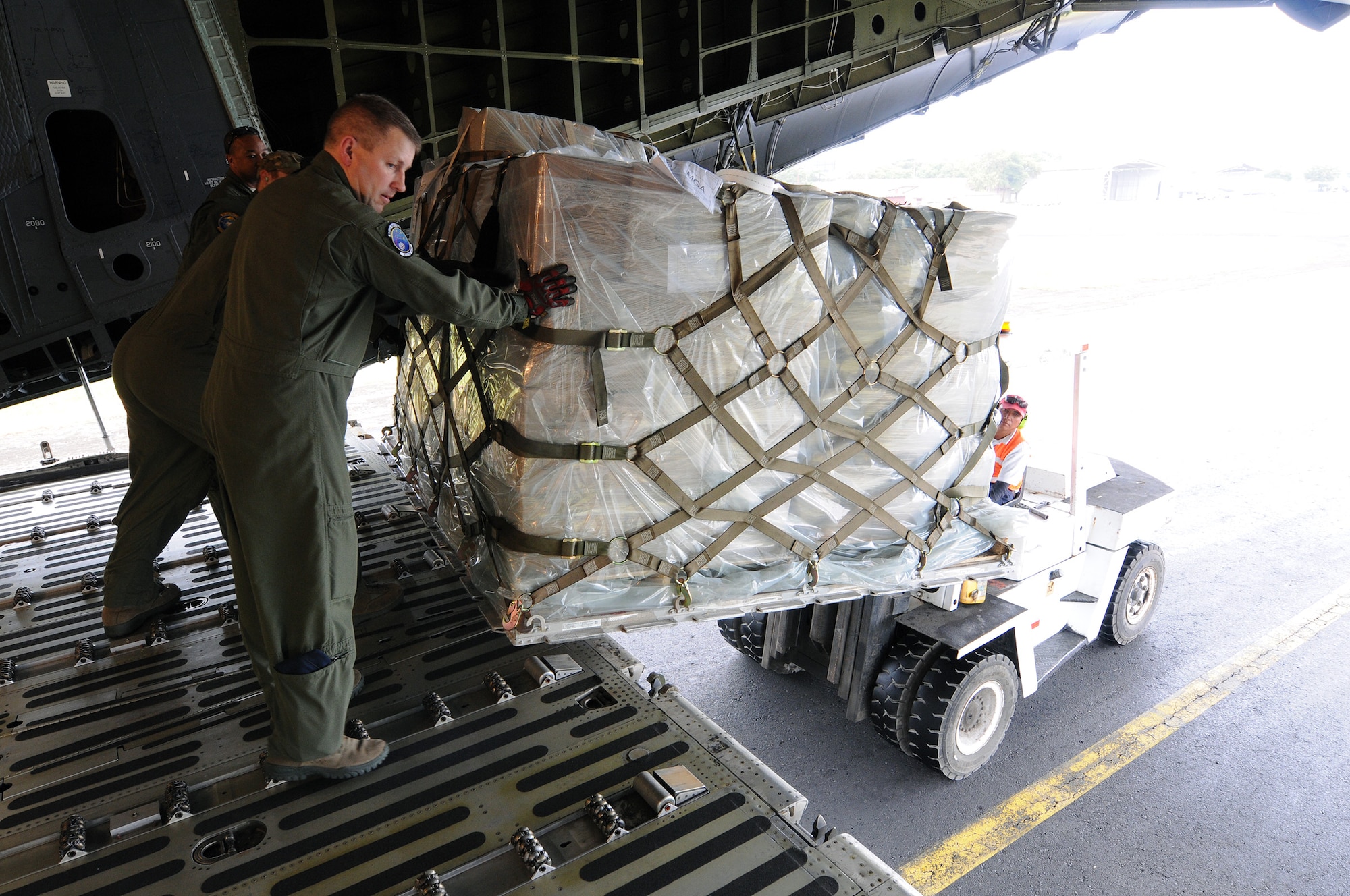 Reserve Airmen from the 512th Airlift Wing delivered humanitarian supplies to Nicaragua aboard a C-5M Super Galaxy Dec. 20, 2014 just in time for the Holidays. 125,000 pounds of food and educational equipment were airlifted to Nicaragua's Augusto C. Sandino International Airport in Managua. The massive delivery was made possible through the Denton Program, a Department of Defense humanitarian assistance transportation program that utilizes space available military air, surface and sea-lift assets. The supplies were provided to World Missions Outreach, which is an international nonprofit organization based in Nicaragua that provides food, education, medical and ministry services to the country's citizens.(U.S. Air Force photo/2nd Lt. Steve Lewis)