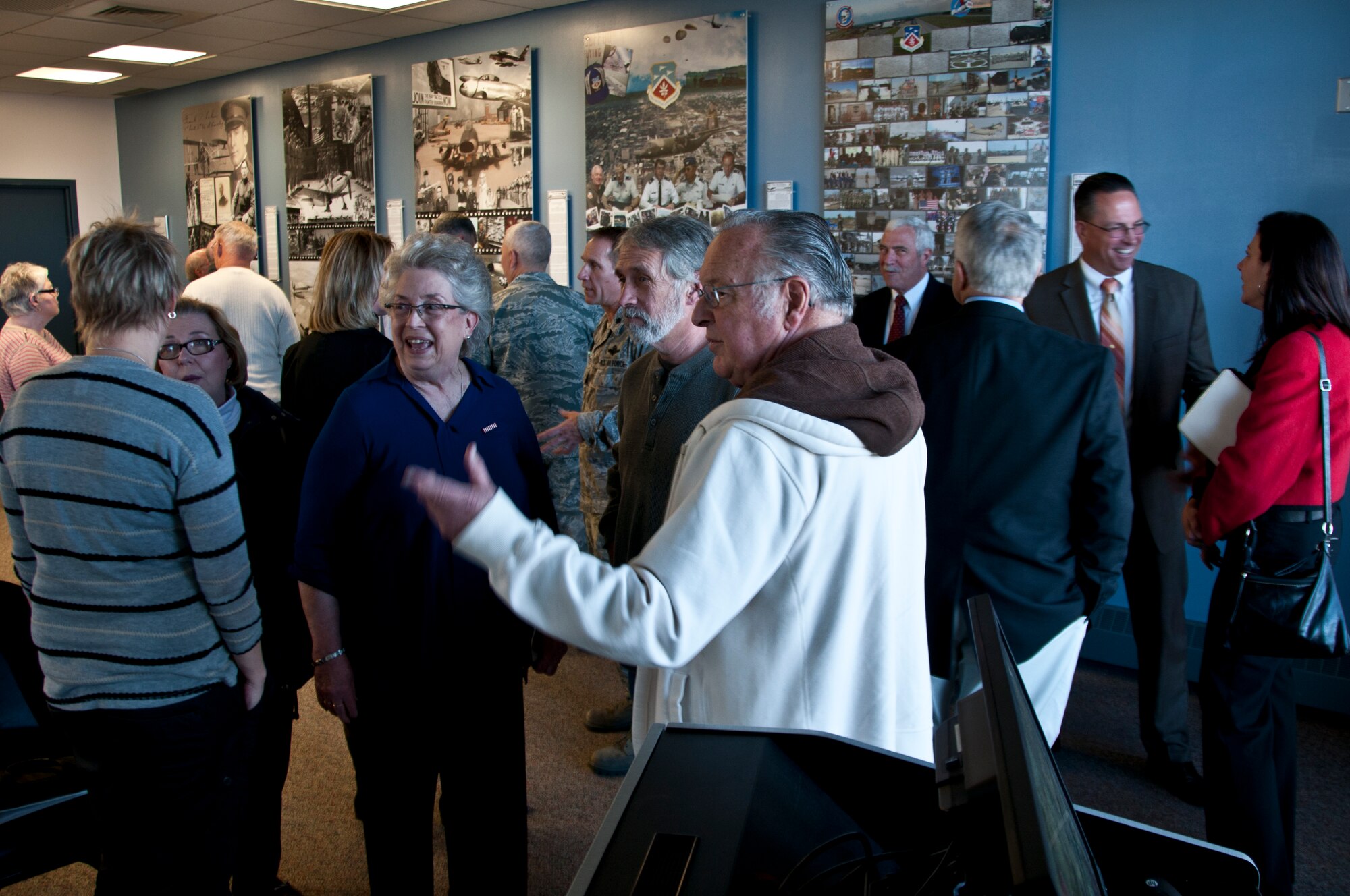 Community leaders, former commanders and members of the 179th Airlift Wing, Mansfield, OH, gathered for the dedication of Larson Hall in the headquarters building, Nov. 5, 2014. Five historical panels depicting images throughout the lifespan of the organization were revealed with a special wall dedicated to Gen. Larson as Larson Hall is named after Ret. Brig. Gen. Fred N. Larson, former commander of the unit.(U.S. Air National Guard Photo by Tech. Sgt. Joe Harwood\Released)
