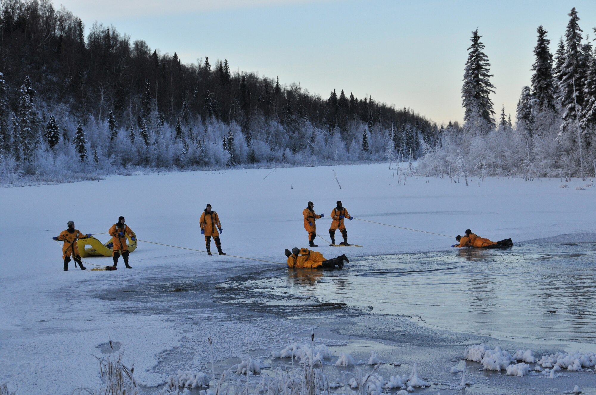 JOINT BASE ELMENDORF-RICHARDSON -- Firefighters of the 673d Civil Engineer Squadron, Joint Base Elmendorf-Richardson, deal with heat, fire and water on a regular basis. Annually though, these firefighters practice their ice water rescue techniques. 
The training prepares firefighters on the proper methods of water rescue; when minutes and seconds count, it pays to be ready to act instinctively. People panic because they haven't practiced, and practice is just what the firefighters were doing last weekend.
Given the number of lakes and open-water sources on and around JBER, water activity and snowmachines could lead to a higher volume of incidents. (U.S. Air Force photo/Mr. Tommie Baker)