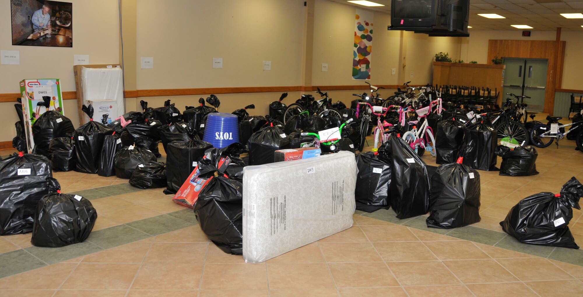 Shown here at the AEDC Angel Tree collection location are gifts for 101 angels that were donated by AEDC personnel. Counselors from the South Central Relative Caregiver Program and the Healthy Families Program collected the items on Dec. 10 and the gifts will be provided to families in need. (Photo by Jacqueline Cowan)