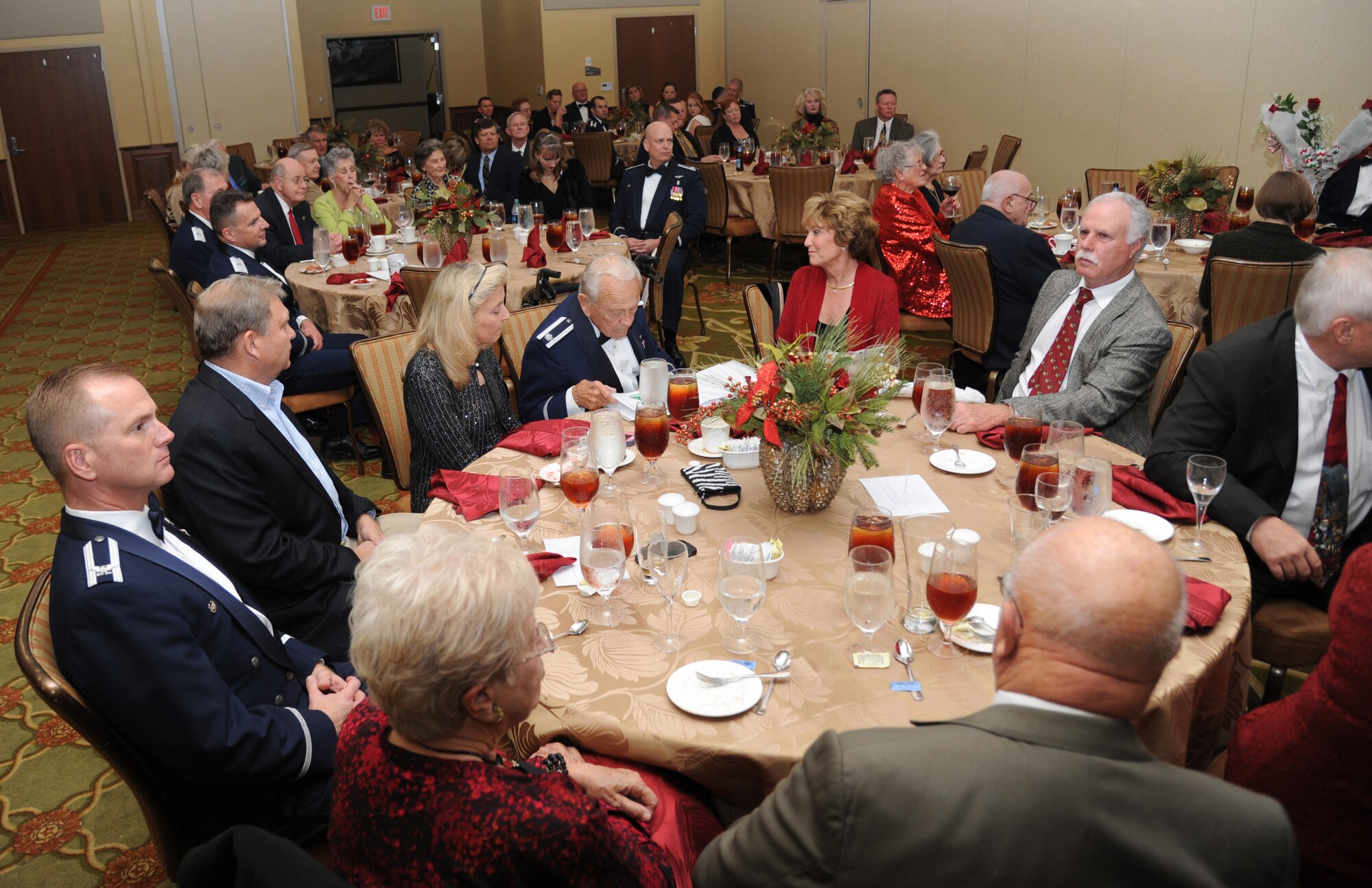 Keesler personnel and members of the Order of Daedalians attend a reception Dec. 18, 2014, at the Bay Breeze Event Center, Keesler Air Force Base, Miss. The Order of Daedalians honors, as its Founder Members, all WW I aviators who were commissioned as officers and rated as military pilots. The Order's membership of commissioned, warrant and flight officer military pilots and WASPs, with its worldwide network of Daedalian Flights and its comprehensive awards program, supports the military services and other aerospace activities.  (U.S. Air Force photo by Kemberly Groue)