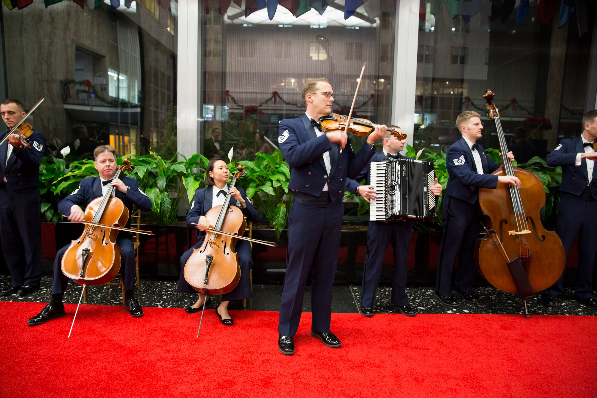 Members of the Air Force Strings, led by Technical Sgt. Luke Wedge, perform on the red carpet before the Kennedy Center Honors. (Photo by Scott Suchman/released)
