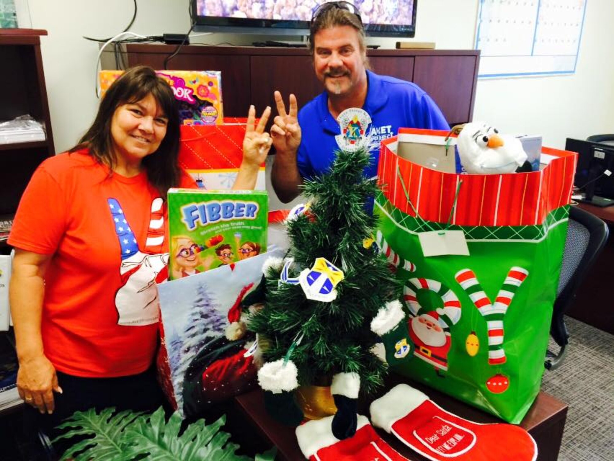 AVET Project, Inc. Kim & Garren Cone dropped off three bags full of Christmas presents to the 920th Rescue Wing at Patrick Air Force Base, Fla., for needy Airmen Dec. 22, 2014. AVET is a non-profit organization with a mission of heightening awareness to the needs of past and present U.S. Service men and women, their families and other needy Americans in providing programs and services of assistance, entertainment, and counseling by enlisting the public's aid. They continue to demonstrate a compassion for military servicepersons that is unwavering. No federal endorsement intended. (U.S. Air Force photo/Maj. Cathleen Snow)