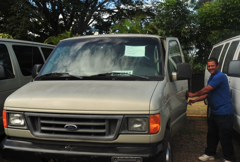 A COPECO personnel opens the door to start the engine of one of the five vehicles donated to COPECO on Soto Cano Air Base, Honduras, Dec. 19, 2014.   The five vehicles were donated to COPECO by JTF-Bravo’s Defense Reutilization and Marketing Office on Soto Cano Air Base.  DRMO transferred the property to the U.S. Agency for International Development, which in turn worked together with JTF-Bravo and ASA to donate the goods to COPECO, an organization dedicated to organizing and coordinating preventive measures and participatory efforts to protect life, property and the environment of the people of Honduras.  (U.S. Air Force photo /Capt. Connie Dillon)


