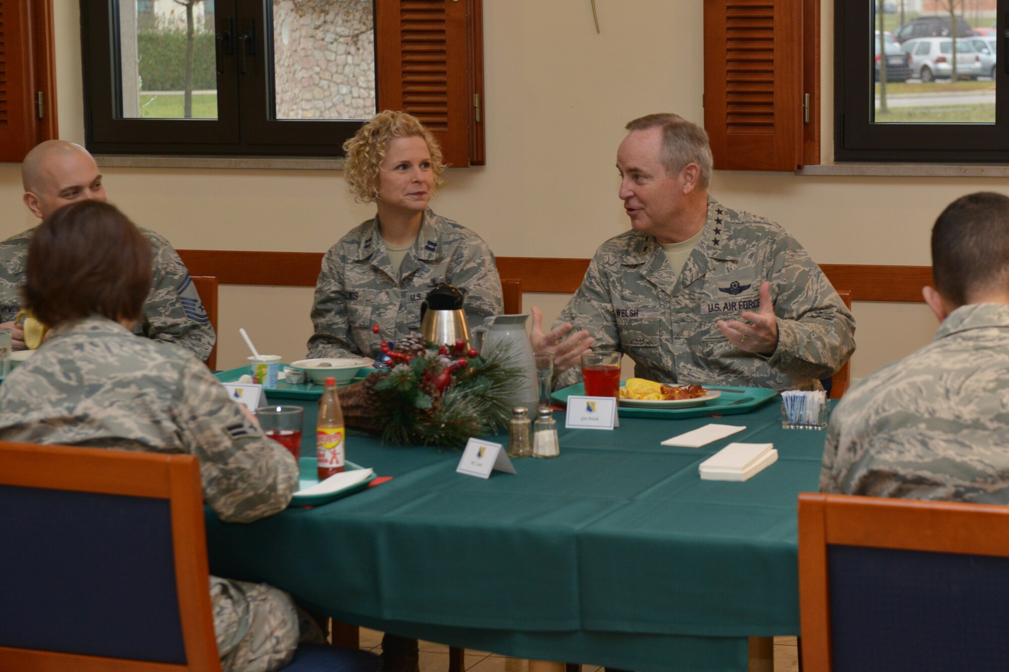 U.S. Air Force Chief of Staff Mark A. Welsh III, talks to several Airmen during a sit-down breakfast, Dec. 22, 2014, at Aviano Air Base, Italy. During the visit to the 31st Fighter Wing, Welsh and Deputy Under Secretary of the Air Force, International Affairs, Ms. Heidi H. Grant received a mission brief, participated in an open discussion during breakfast with Airmen and hosted an all-call to address some of the main challenges the Air Force will face in 2015 and beyond. (U.S. Air Force photo by Airman 1st Class Ryan Conroy/Released)