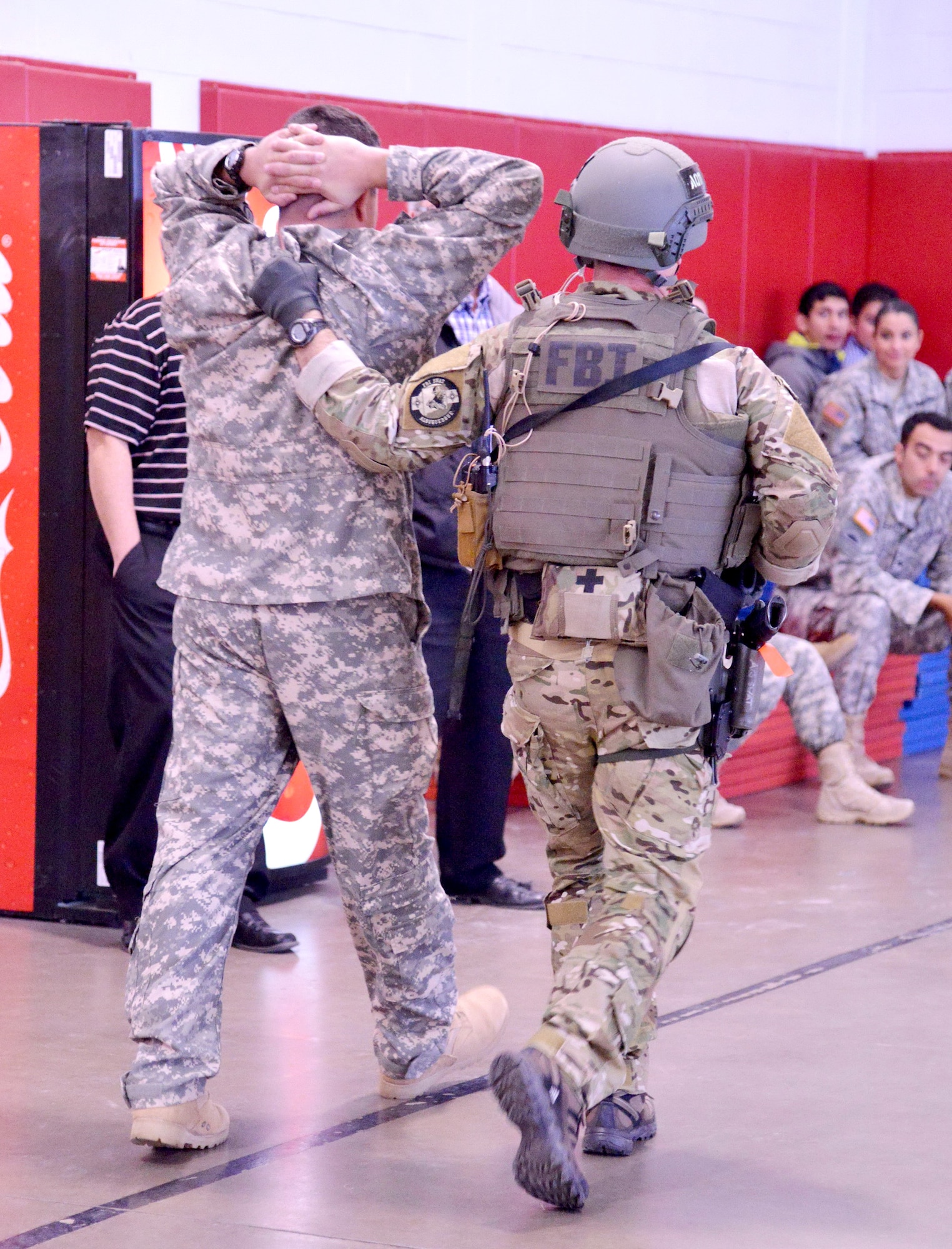 A participant in an active shooter exercise is taken into custody by an FBI agent. The New Mexico National Guard hosted the exercise to help prepare law enforcement in case they need to respond to an actual event. There were eight agencies involved in the training, including the FBI, Albuquerque Police Department, Bernalillo County Sheriff’s Department and Department of Homeland Security. (Photo by Jamie Burnett)