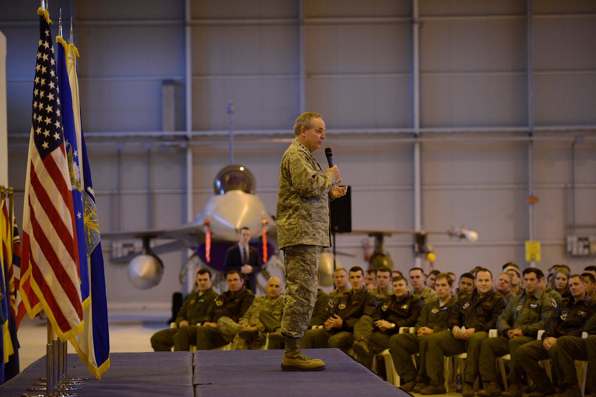 U.S. Air Force Chief of Staff, Gen. Mark A. Welsh III, addresses Team Aviano Airmen during an all-call, Dec. 22, 2014, at Aviano Air Base, Italy. Among the topics discussed at the all-call were force shaping, fleet modernization and renewing an operational focus in the face of persisting fiscal austerity. (U.S. Air Force photo by Staff Sgt. Evelyn Chavez/Released)
