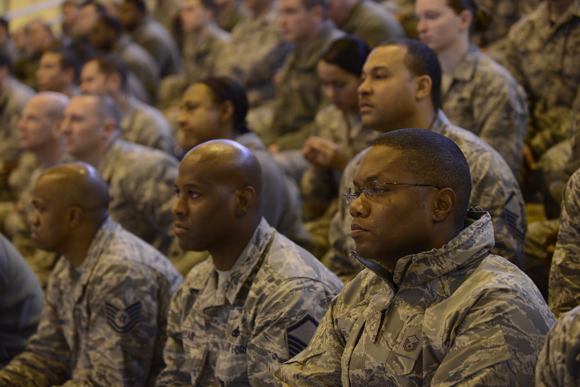 Team Aviano Airmen participate in an all-call held by the U.S. Air Force Chief of Staff Gen. Mark A. Welsh III, Dec. 22, 2014, at Aviano Air Base, Italy. Approximately 600 Airmen and their families were in attendance. (U.S. Air Force photo by Staff Sgt. Evelyn Chavez/Released) 