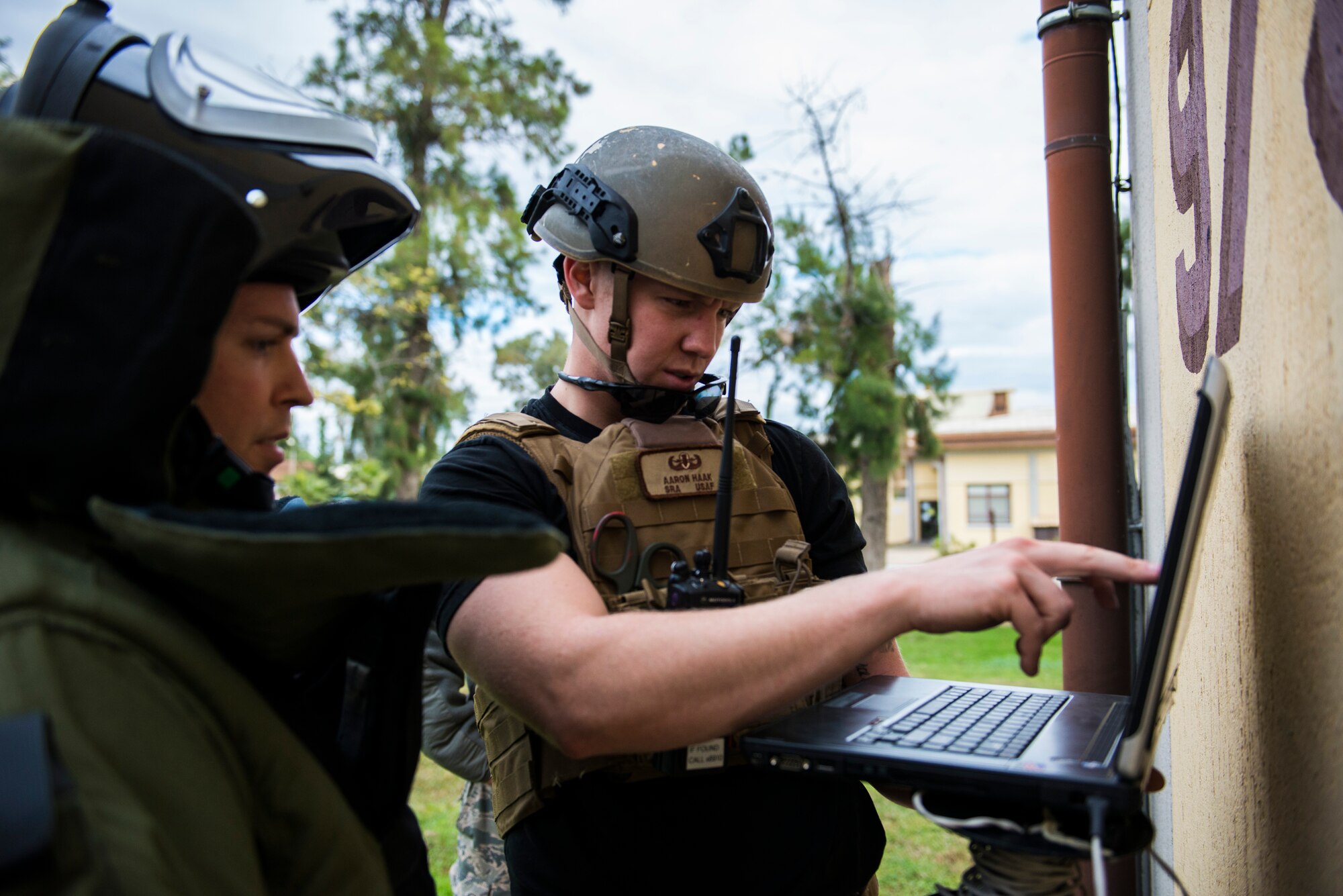 Staff Sgt. Daniel Esselstrom, 39th Civil Engineer Squadron Explosive Ordnance Disposal, (left), and Senior Airman Aaron Haak, 39th CES EOD journeyman, (right), examine an X-Ray used during in an emergency response exercise Dec. 19, 2014, at Incirlik Air Base, Turkey. EOD has many methods used to determine and dispose of threats during combat. (U.S. Air Force photo by Airman Cory W. Bush/Released)