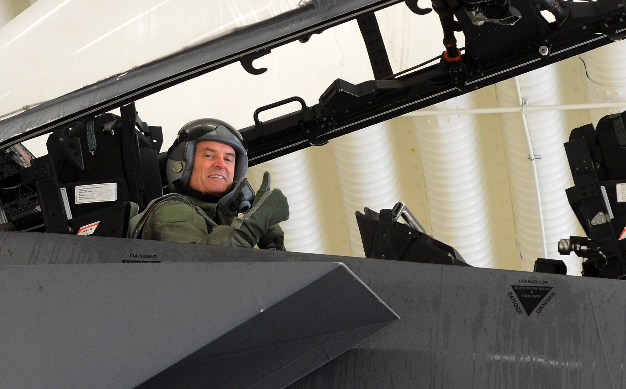 U.S. Air Force Lt. Gen. Darryl Roberson, 3rd Air Force and 17th Expeditionary Air Force commander, gives a thumbs up before taking off in a F-15E Strike Eagle fighter aircraft at Spangdahlem Air Base, Germany, Dec. 18, 2014. Roberson participated in Iron Hand 15-2 to gain first-hand knowledge of the training exercise. (U.S. Air Force photo by Airman 1st Class Luke Kitterman/Released)