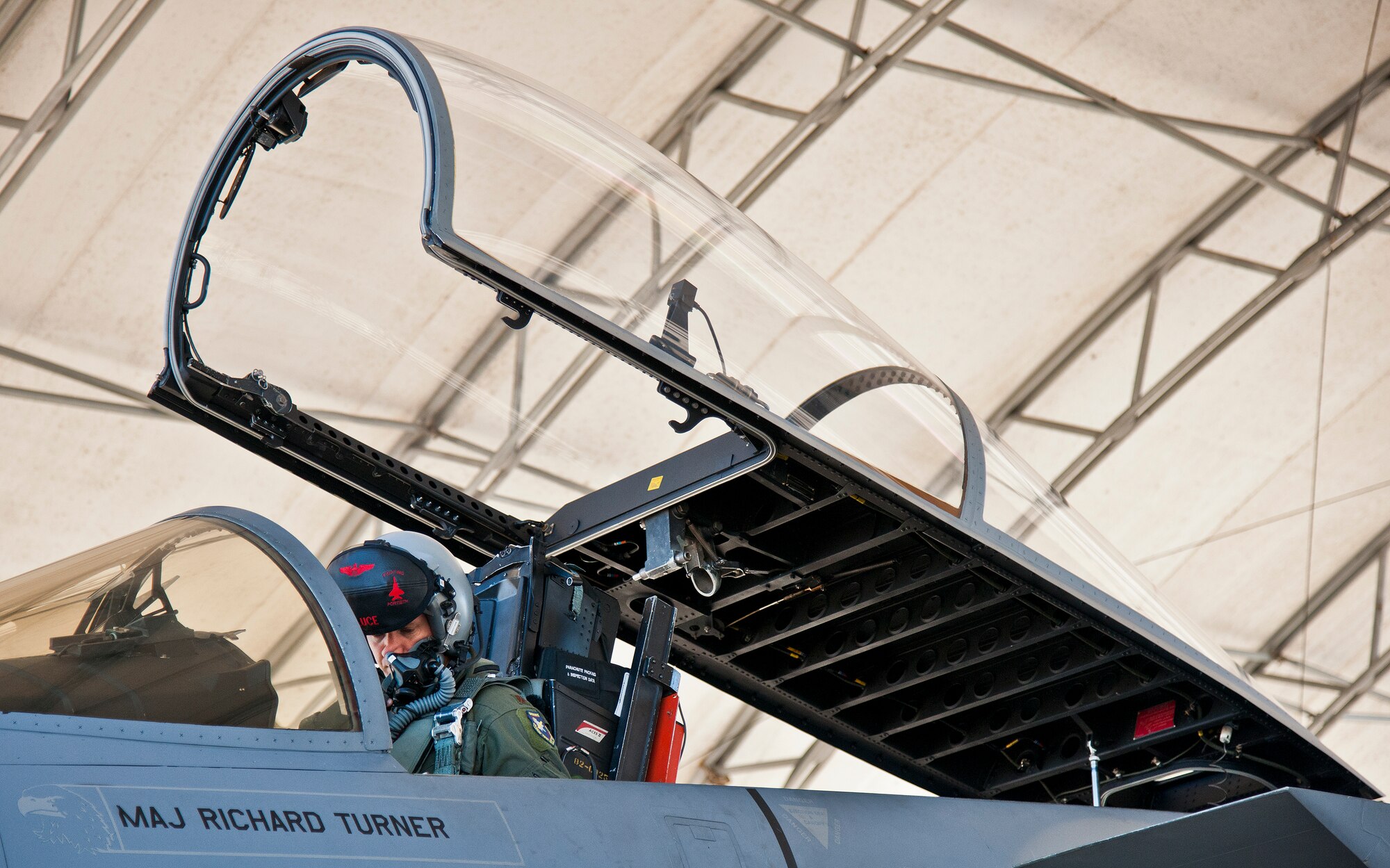 Maj. Christopher Wee, Operation Flight Program Combined Test Force, settles into his F-15 Eagle prior to a morning sortie at Eglin Air Force Base, Fla.  The OFPCTF Airmen fly test missions exclusively in various F-15 models. The OFPTCF is partially owned by both the 53rd Wing and 96th Test Wing. (U.S. Air Force photo/Samuel King Jr.)