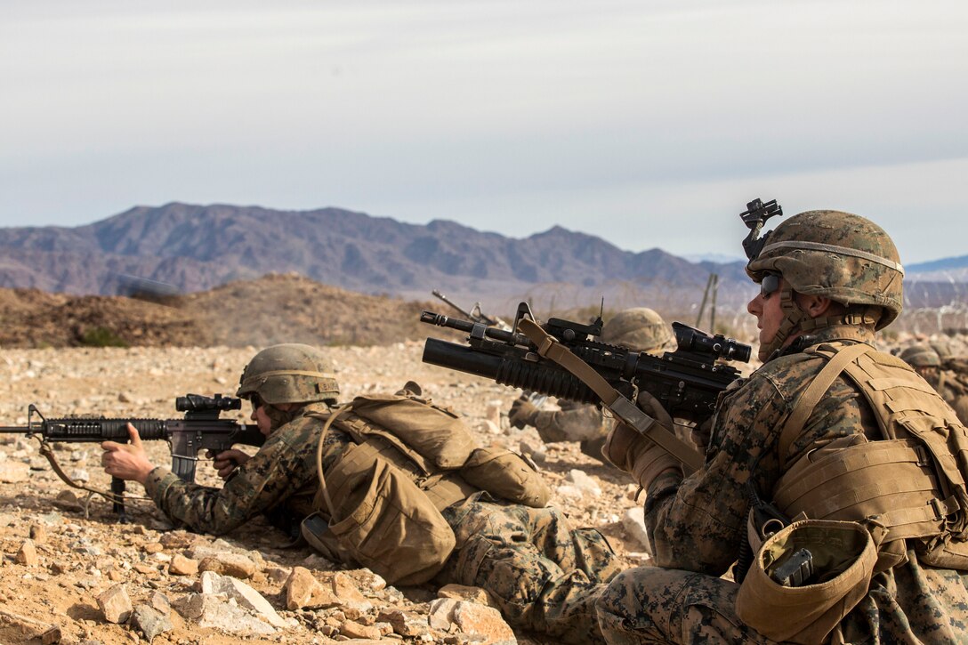 Marine Corps Lance Cpl. Corey W. Dahmen, right, engages targets during a combined arms exercise on Marine Corps Air Ground Combat Center, Twentynine Palms, Calif., Dec. 15, 2014. Dahmen is a team leader assigned to the Battalion Landing Team, 3rd Battalion, 1st Marine Regiment, 15th Marine Expeditionary Unit. 