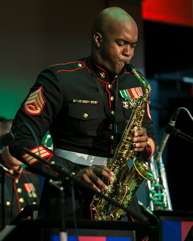 Staff Sgt. D. DeMarius Jackson performs a saxophone solo for the song “Deck the Halls”  Dec. 9 during a III Marine Expeditionary Force band Christmas concert at the Kubasaki High School auditorium on Camp Foster. The concert was filled with a variety of Christmas songs performed by the jazz ensemble of the III MEF band, known as the “Big Band.” The concert was open to Okinawa community members for an opportunity to share in the traditions of the Christmas season. Jackson, a native of Aiken, South Carolina, is a saxophone musician with the III MEF band. 