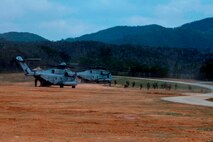 U.S. Marines with Company E, Battalion Landing Team, 2nd Battalion 4th Marines, 31st Marine Expeditionary Unit (MEU), offload from a CH-53 Super Stallion as they conduct a vertical assault during MEU Exercise (MEUEX), in Combat Town, Okinawa, Japan, Dec 10, 2014. BLT 2/4 is conducting training in preparation of their upcoming spring patrol.  (U.S. Marine Corps photo by GySgt Ismael Pena/Released)