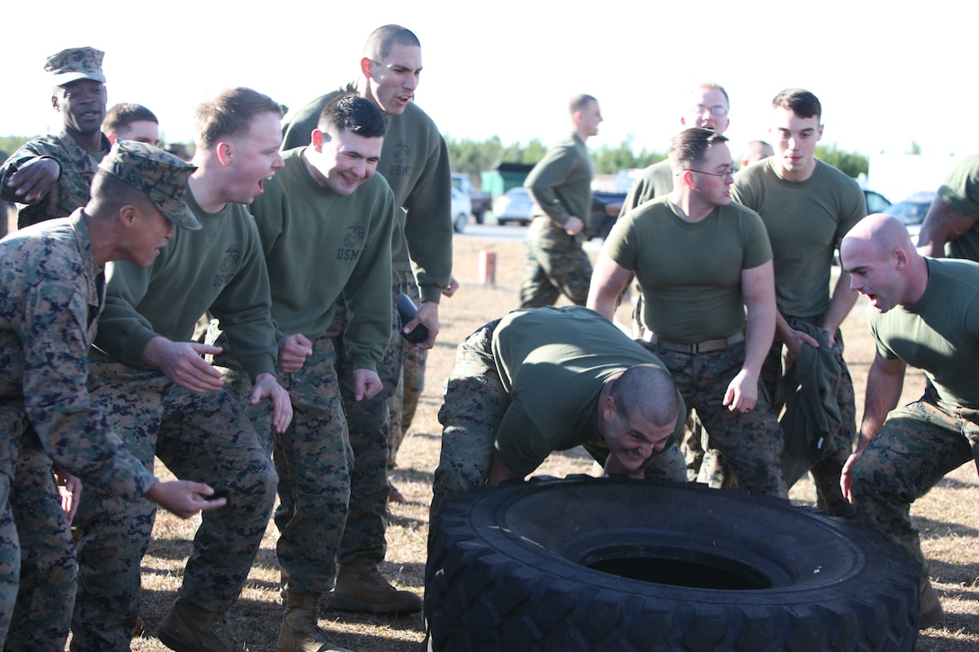 Cpl. Alexander Beauchene lifts a tire during the biannual Marine Wing Communications Squadron 28 Spartan Cup at Marine Corps Air Station Cherry Point, N.C., Dec. 18, 2014. The competition is held to increase operational readiness throughout the squadron. Beauchene, a Bradenton, Fla. native, is a field wireman with MWCS-28. 