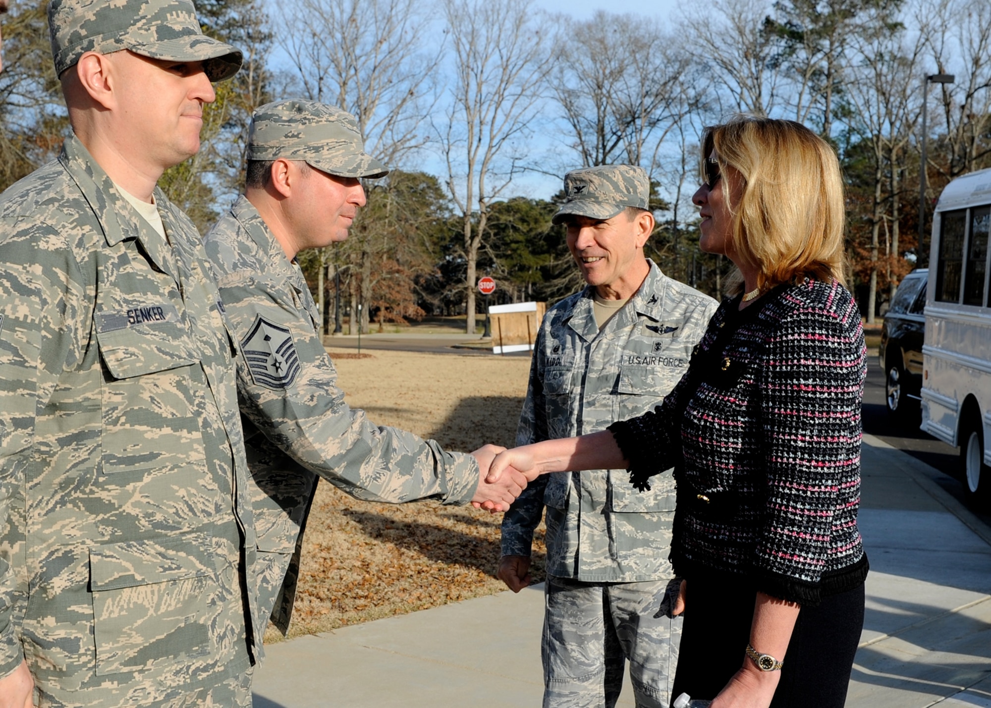 Members of the 14th Medical Group meet Secretary of the Air Force Deborah Lee James outside of the Koritz Clinic Dec. 17, 2014, during her visit to Columbus Air Force Base, Miss. Along with touring some of the base facilities, James sat down with groups of Airmen to answer questions, and learn more about their daily missions. (U.S. Air Force Photo/Elizabeth Owens)
