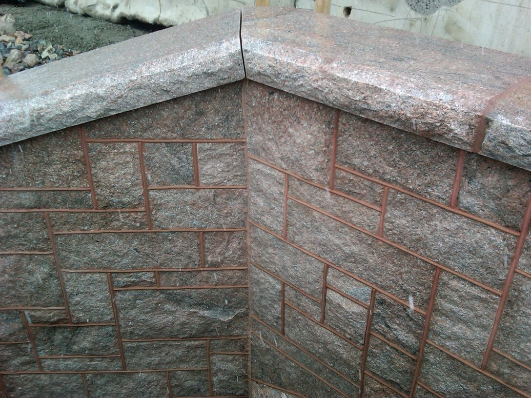 Masonry stone façade on the new Brookline Avenue precast concrete culvert, which is part of the Muddy River Flood Risk Management Project in Boston, Massachusetts.