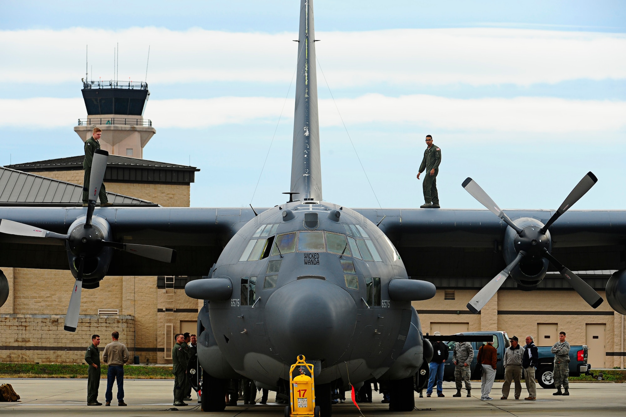 Airman 1st Class Taylor Williams and Ian Robinson, 4th Special Operations Squadron special missions aviators, perform their last post flight check on an AC-130H Spectre gunship nicknamed “Wicked Wanda” on Hurlburt Field, Fla., Dec. 19, 2014. ”Wicked Wanda” was flown during the Iran Hostage Crisis. (U.S. Air Force photo/Senior Airman Desiree W. Moye)