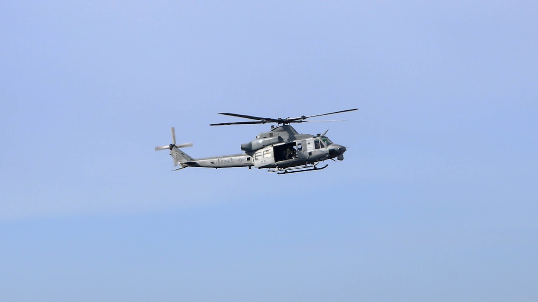 A UH-1Y Venom waits to perform a simulated close air support Hell Fire missile mission at Bombing Target Range 11, Piney Island, N.C., Dec. 18, 2014. Marines with Light Attack Helicopter Squadron 167, HMLA-467 and Marine Unmanned Aerial Vehicle Squadron 2 assisted 2nd Marine Special Operations Battalion during an integrated training mission. The Venom belongs HMLA-167 at Marine Corps Air Station New River, N.C.
