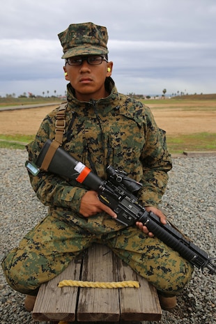 Recruit Bacra E. Ruth, Platoon 3246, waits for his turn to fire his weapon during firing week at Edson Range, Marine Corps Base Camp Pendleton, Dec. 16. Ruth is a Long Beach, Calif., native and was recruited out of Recruiting Substation Culver City, Calif.