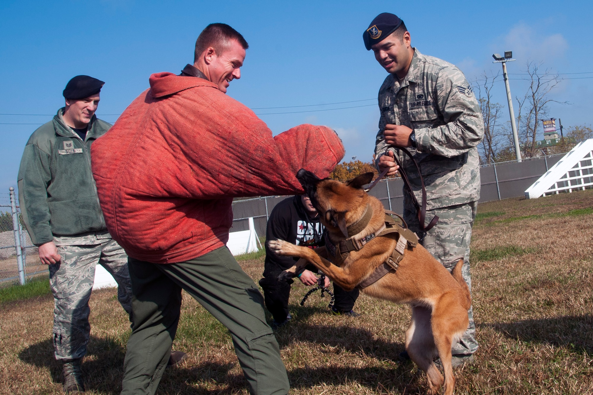 Col. Kenneth “Wolf” Ekman, 8th Fighter Wing commander, wears the K-9 training bite suit during an immersion with the 8th Security Forces Squadron military working dog section at Kunsan Air Base, Republic of Korea, Nov. 14, 2014. Wolf awarded Senior Airman George Garcia, 8th Security Forces Squadron military working dog handler, the top performer award for the week. (U.S. Air Force photo by Senior Airman Taylor Curry/Released)  