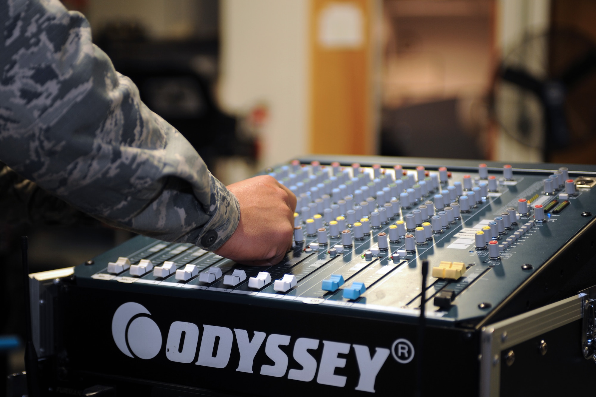 U.S. Air Force Staff Sgt. Luis Permont, 355th Communications Squadron radio frequency transmissions systems supervisor, adjusts filters on a mixer to test a sound system output at Davis-Monthan Air Force Base, Ariz., Dec. 22, 2014. The radio frequency transmissions shop performs maintenance on the mixer every 84 days to ensure it is fully functional and prepared for official ceremonial support. (U.S. Air Force photo by Airman 1st Class Cheyenne Morigeau/Released)