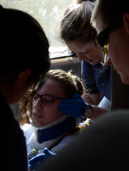 Students attending the Texas State Technical College emergency medical technician course practice stabilizing a victim’s neck Dec. 12, 2014, at Texas State Technical College in Abilene, Texas. The EMT students were participating in a mass casualty exercise alongside Dyess firefighters, which served as a final project for the students’ basic training course. Many of the students will go on to additional training to become emergency responders. (U.S. Air Force photo by Senior Airman Peter Thompson/Released)