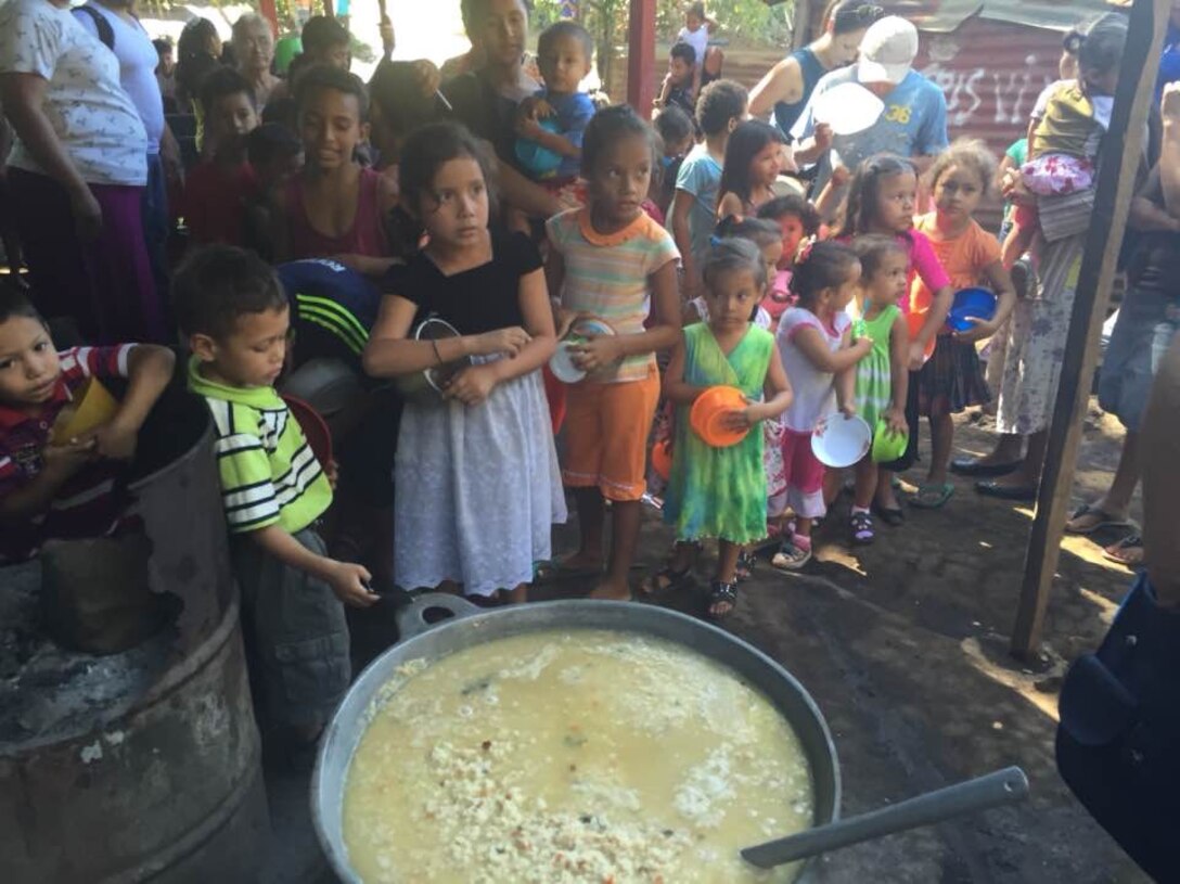 In this undated photo, children in Nicaragua wait to receive food through a feeding program provided by international nonprofit organization, World Missions Outreach. A Reserve aircrew from the 512th Airlift Wing, Dover Air Force Base, Delaware, delivered almost 125,000 pounds of food and other humanitarian supplies to Nicaragua for WMO on Dec. 20, 2014. The delivery was made possible through the Department of Defense's Denton Program. (Courtesy photo) 