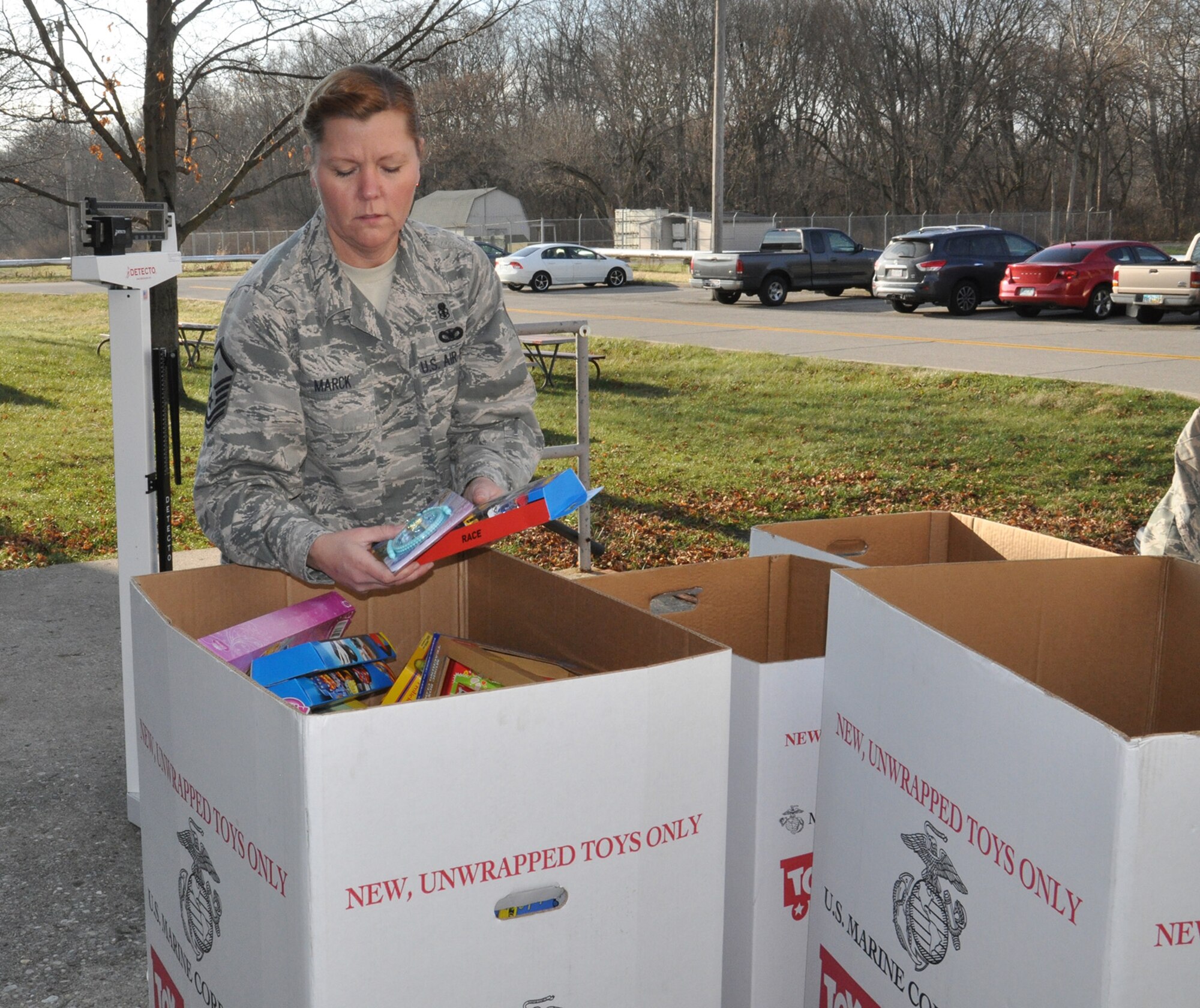 WRIGHT-PATTERSON AIR FORCE BASE, Ohio – Master Sgt. Glenda Marck, program manager, 445th Development and Training Flight/first sergeant, 89th Airlift Squadron, sorts through donated toys for the Toys for Tots campaign Dec. 15, 2014. The 445th Airlift Wing collected 573 toys weighing more than 240 pounds. (U.S. Air Force photo/Stacy Vaughn)