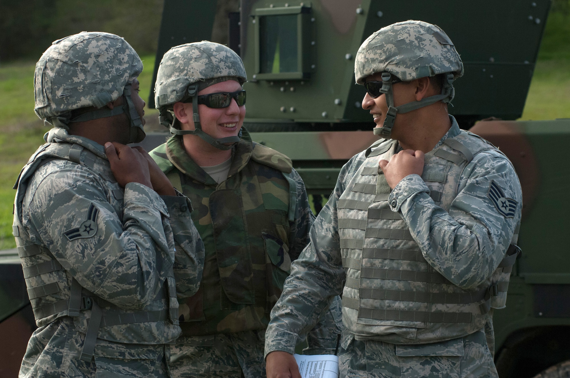 Airman First Class Eric Collins, Airman First Class Dylan Rogers and Staff Sergeant Jack Flores Jimenez, 30 LRS Vehicle Operators, gather with their convoy team members for an after action report after completing the first half of a simulated convoy mission Dec. 18, 2014, Vandenberg Air Force Base, Calif.. Combat Operational Readiness Training (CORT) includes exercise preparation actions to properly prepare Vehicle Operations personnel for wartime duties. Airmen must possess the necessary skills to meet mission demands and predict future events if possible. The goal of this training is to ensure Airmen are able to operate and survive in a contingency or wartime environment as a team. (U.S. Air Force photo by Michael Peterson/Released)