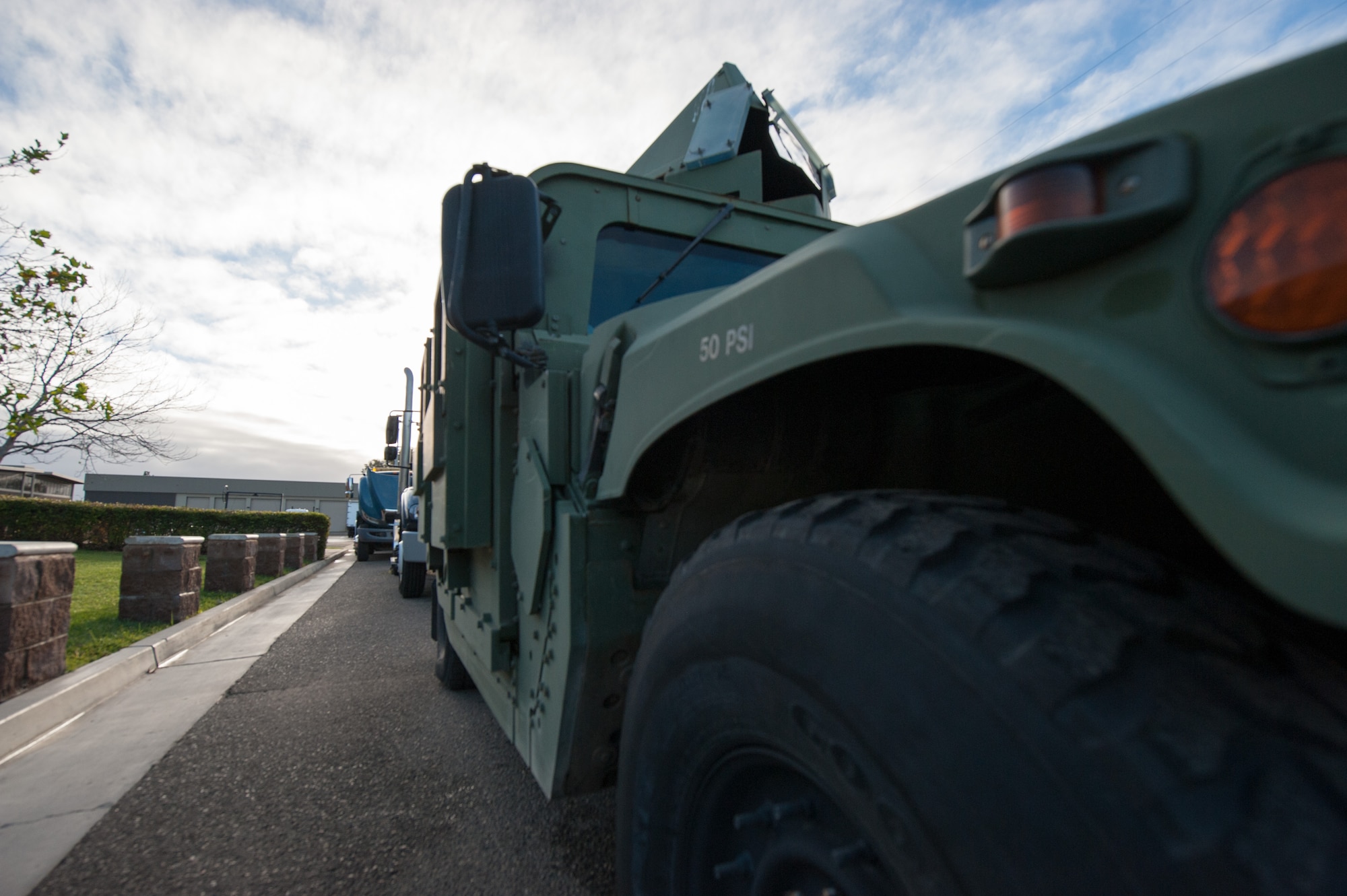 A military Humvee is parked at the head of a convoy line in preparation for Combat Operational Readiness Training by the 30th Logistics Readiness Squadron Dec. 18, 2014, Vandenberg Air Force Base, Calif. CORT includes exercise preparation actions to properly prepare Vehicle Operations personnel for wartime duties. Airmen must possess the necessary skills to meet mission demands and predict future events if possible. The goal of this training is to ensure Airmen are able to operate and survive in a contingency or wartime environment as a team. (U.S. Air Force photo by Michael Peterson/Released)