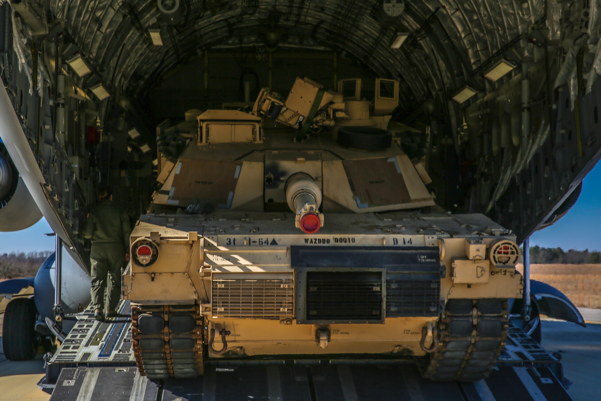 An Abrams M1A2 tank moves up the ramp of a C-17 Globemaster III Dec. 11, 2014 at North Air Force Auxiliary Field in North, S.C. The tank movement was part of a two-day exercise which integrated C-17 air and ground crew training for 315th Airlift Wing Airmen stationed at Joint Base Charleston, S.C. as well as Soldiers from one of the 3rd Infantry Division’s Immediate Ready Companies stationed at Fort Stewart, Ga. Four C-17’s were used during the exercise to deploy and redeploy two Abrams M1A2 tanks, an M88 recovery vehicle and two M2A3 Bradley Fighting Vehicles. (U.S. Air Force photo by Tech. Sgt. Shane Ellis)