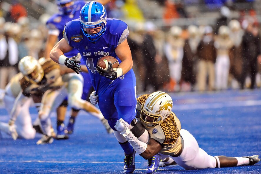 Air Force running back Shayne Davern powers his way to the Western Michigan 3-yard line in the first half of the Famous Idaho Potato Bowl in Boise, Idaho, Dec. 20, 2014, on a drive that gave Air Force a 20-10 lead. The Falcons defeated the Broncos, 38-24, with Davern running for 101 yards and two touchdowns. (U.S. Air Force photo/Liz Copan)