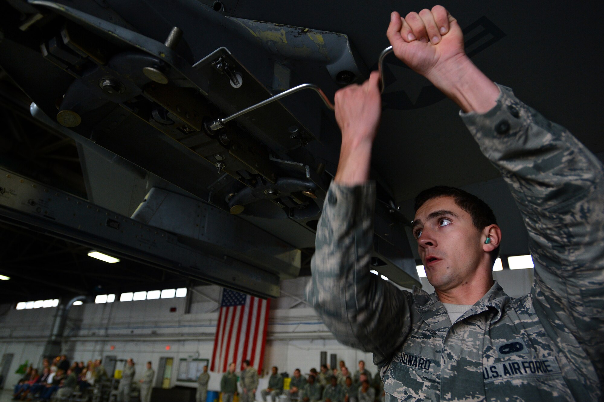 U.S. Air Force Airman 1st Class Cody Howard, 20th Aircraft Maintenance Squadron weapons load crew member assigned to crew 79-10 “Tigers”, tightens a bolt on an F-16CM Fighting Falcon pylon during a weapons load crew of the quarter competition at Shaw Air Force Base, S.C., Dec. 22, 2014. Howard worked with Staff Sgt. Robert Olsen and Senior Airman Alexander Lopez, both 20th AMXS weapons load crew members, to load munitions onto the jet as quickly as possible in an effort to win the competition. (U.S. Air Force photo by Staff Sgt. Kenny Holston/Released)