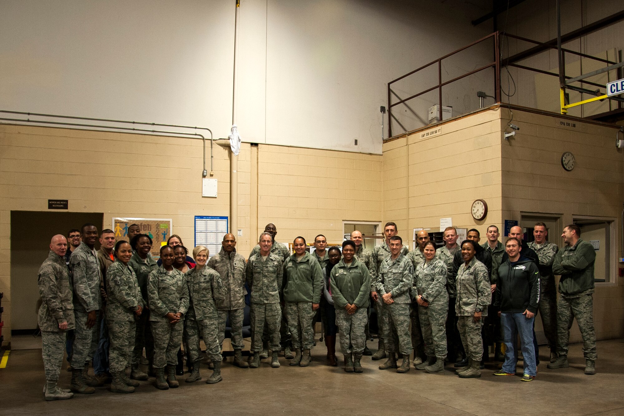 GOODFELLOW AIR FORCE BASE, Texas – Team Goodfellow members pose for a photo after packing boxes during Operation Warmheart at the commissary warehouse Dec. 23. Volunteers helped fill 140 boxes for members of Team Goodfellow. (U.S. Air Force photo/ Airman 1st Class Scott Jackson)