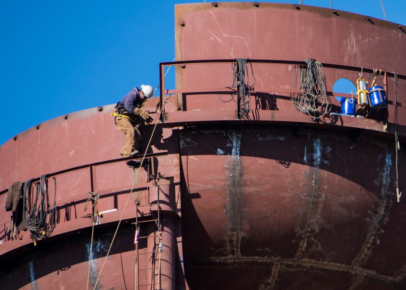 A contractor steadies himself while working high atop a new water tower being built at Duke Field, Fla.  The new water tower will support water distribution capacity for future development planned for Duke's west side.  (U.S. Air Force photo/Tech. Sgt. Jasmin Taylor)