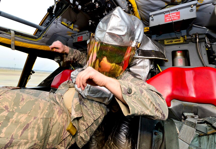 Senior Airman Nicholas Altobelli, 2nd Civil Engineer Squadron lead firefighter, removes a simulated casualty from a B-52H Stratofortress during an aircrew egress exercise on Barksdale Air Force Base, La., Dec. 22, 2014. Aircrew egress exercises are performed twice a year to help firefighters develop their skills. (U.S. Air Force photo/Airman 1st Class Mozer O. Da Cunha)